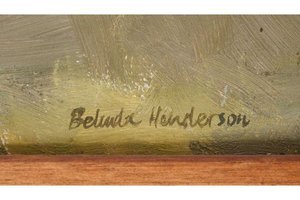 Signature on a wooden surface with a textured background