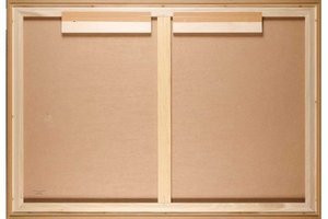 Wooden sliding door with a metallic handle on a plain background