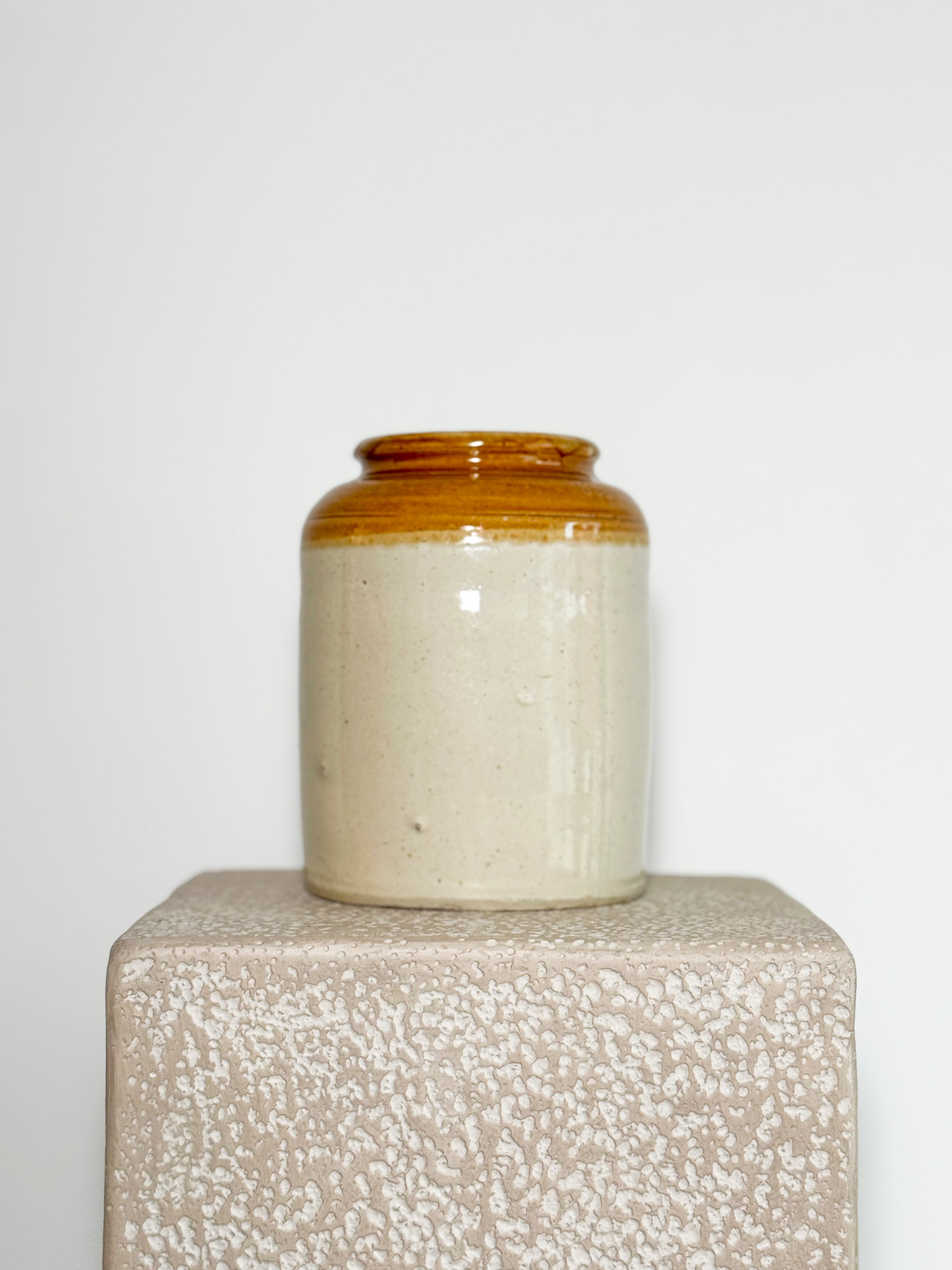 antique or vintage salt-glazed stoneware jar, originally used for preserves, pickles, or food storage.