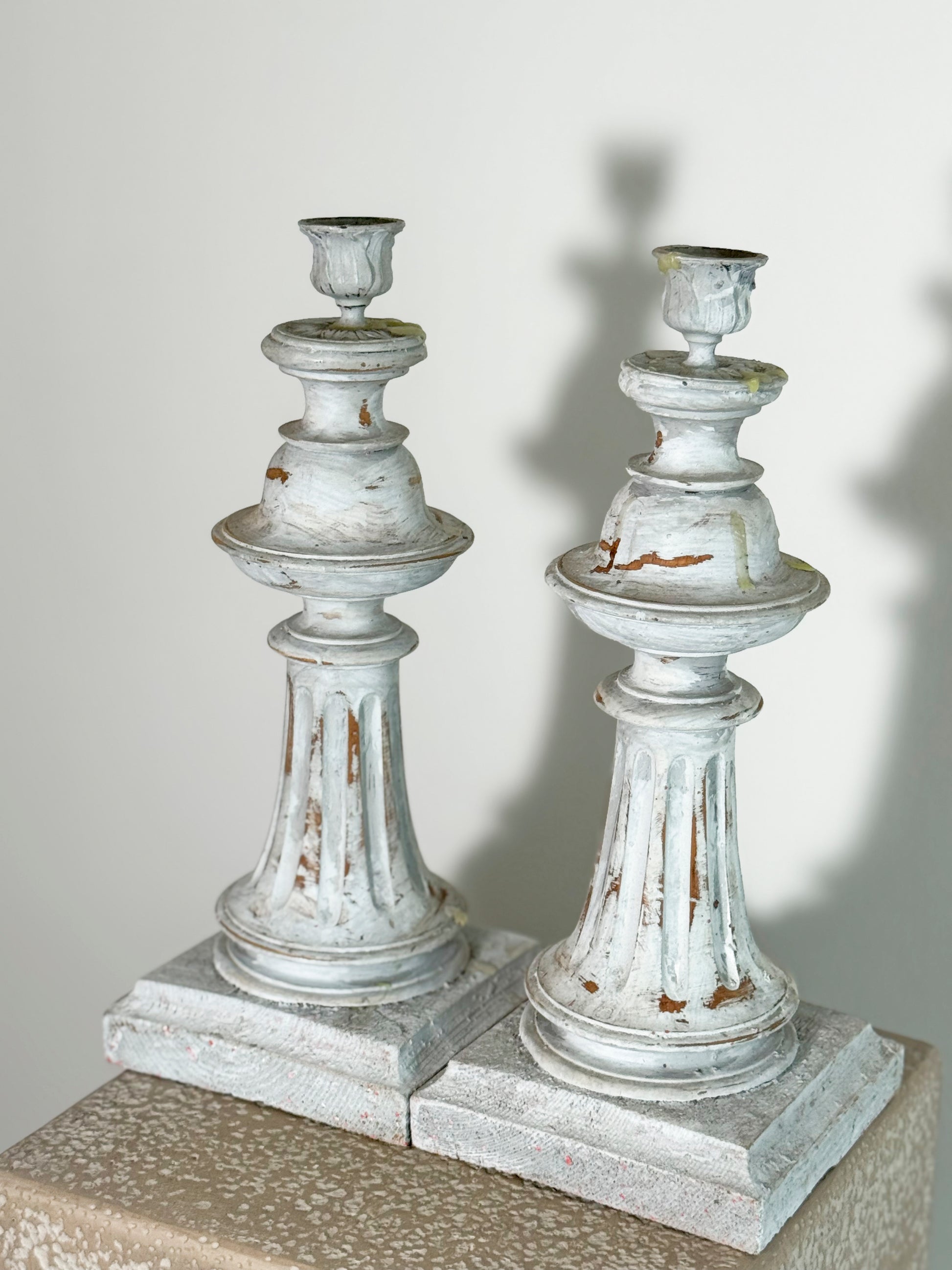 French distressed candle sticks featuring an elegant, distressed grey finish, commonly known as the shabby chic