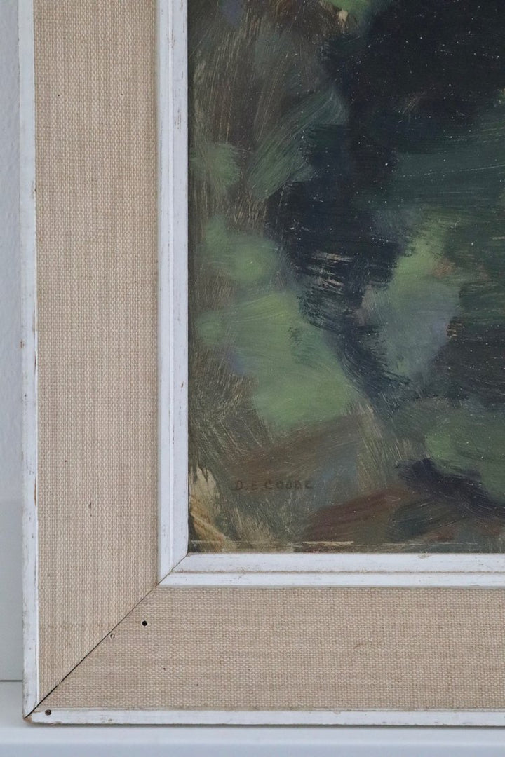 Close-up of a painting with a textured beige frame.