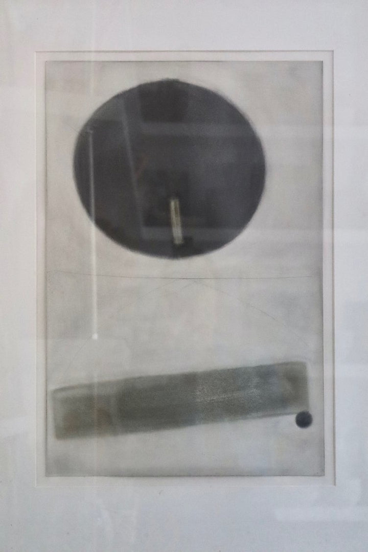 Abstract art piece with circular and rectangular shapes on a light background