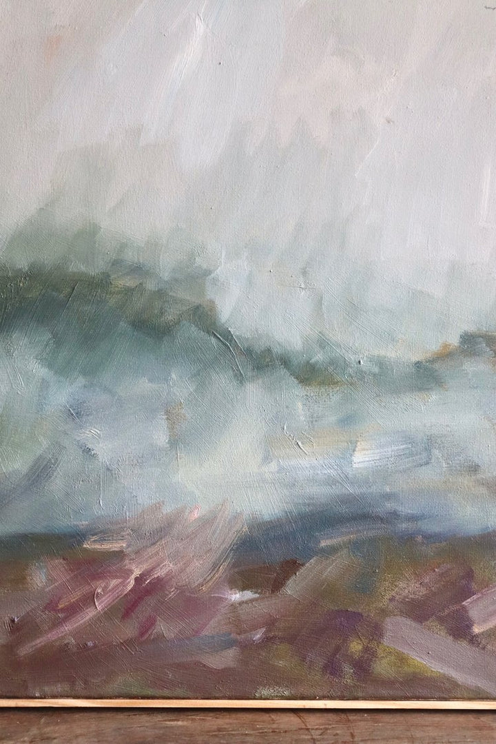 Abstract painting with textured brushstrokes on a wooden surface