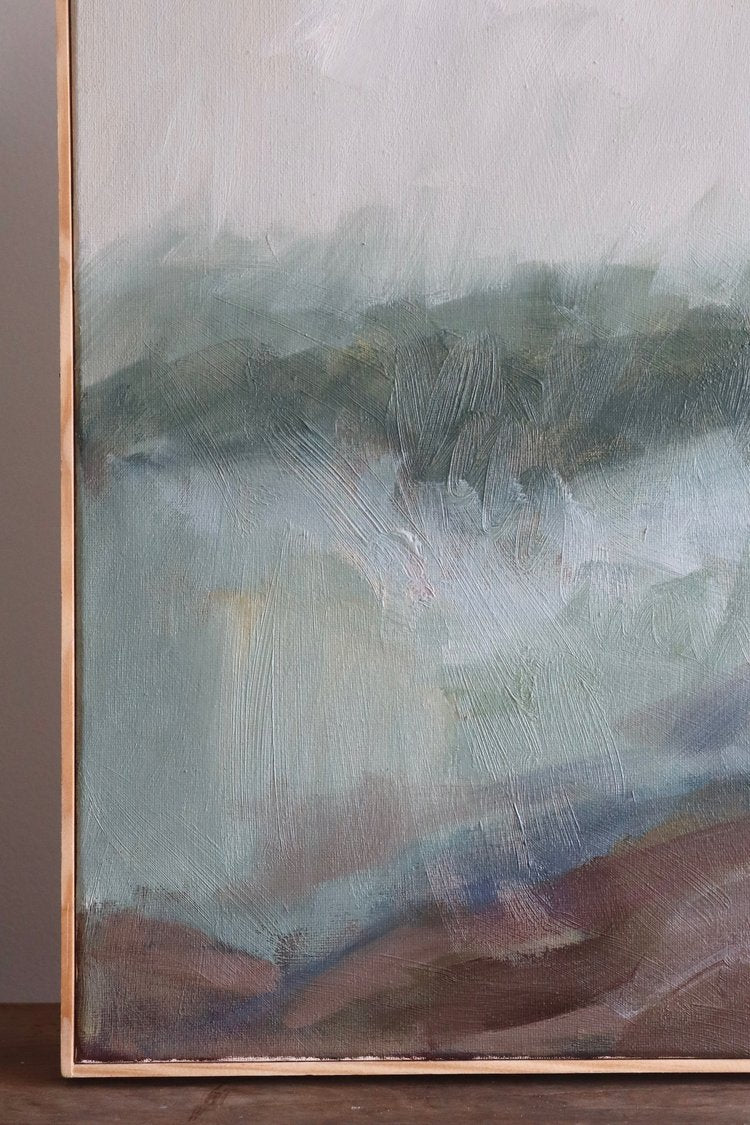 Abstract painting with earthy tones on a wooden surface