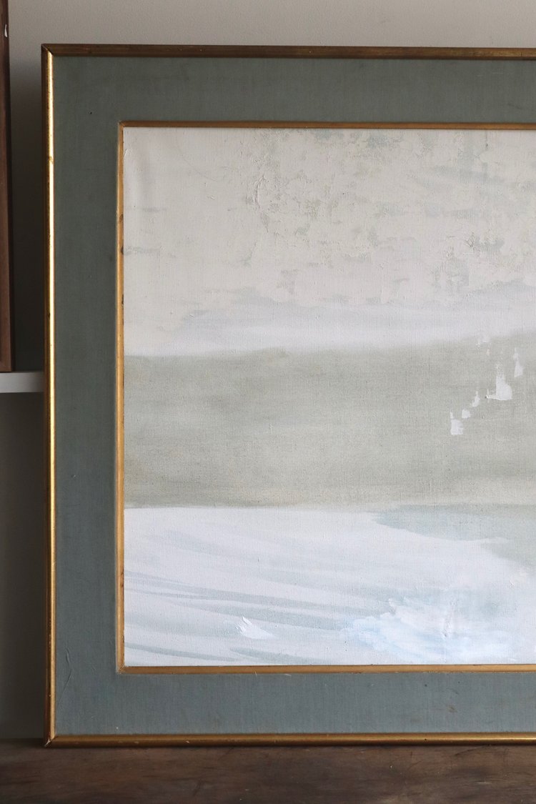 Framed abstract artwork with a gold border on a neutral background