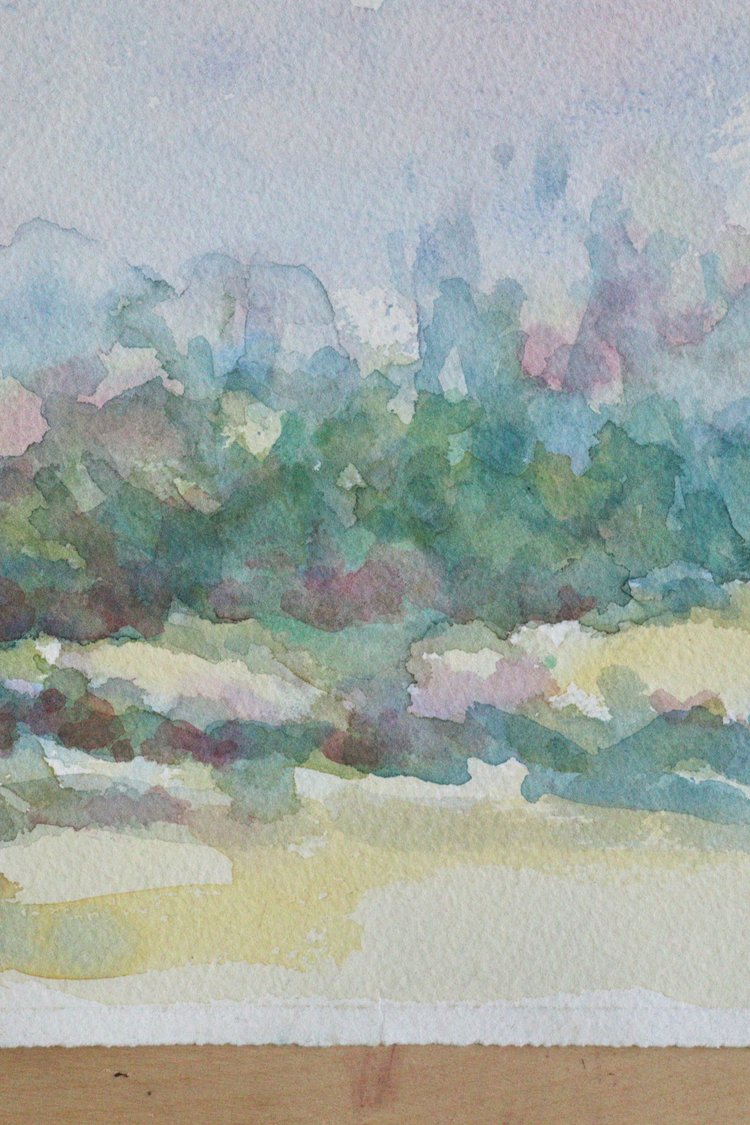 Watercolor landscape with trees and a path on a textured paper background