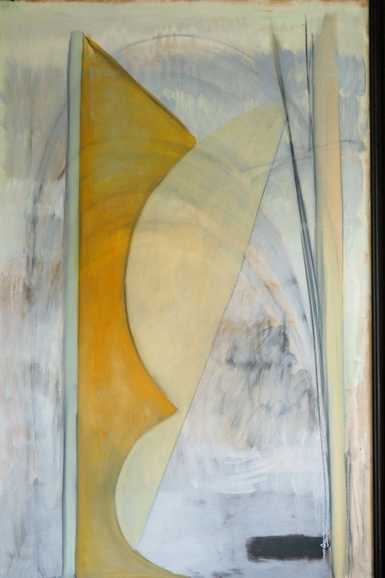 Abstract art piece with wavy shapes in yellow, beige, and gray on a textured background