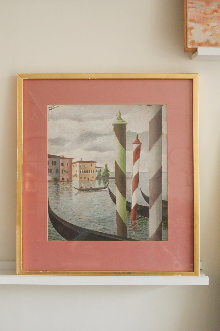 Framed artwork of a Venetian canal scene with a striped lighthouse.