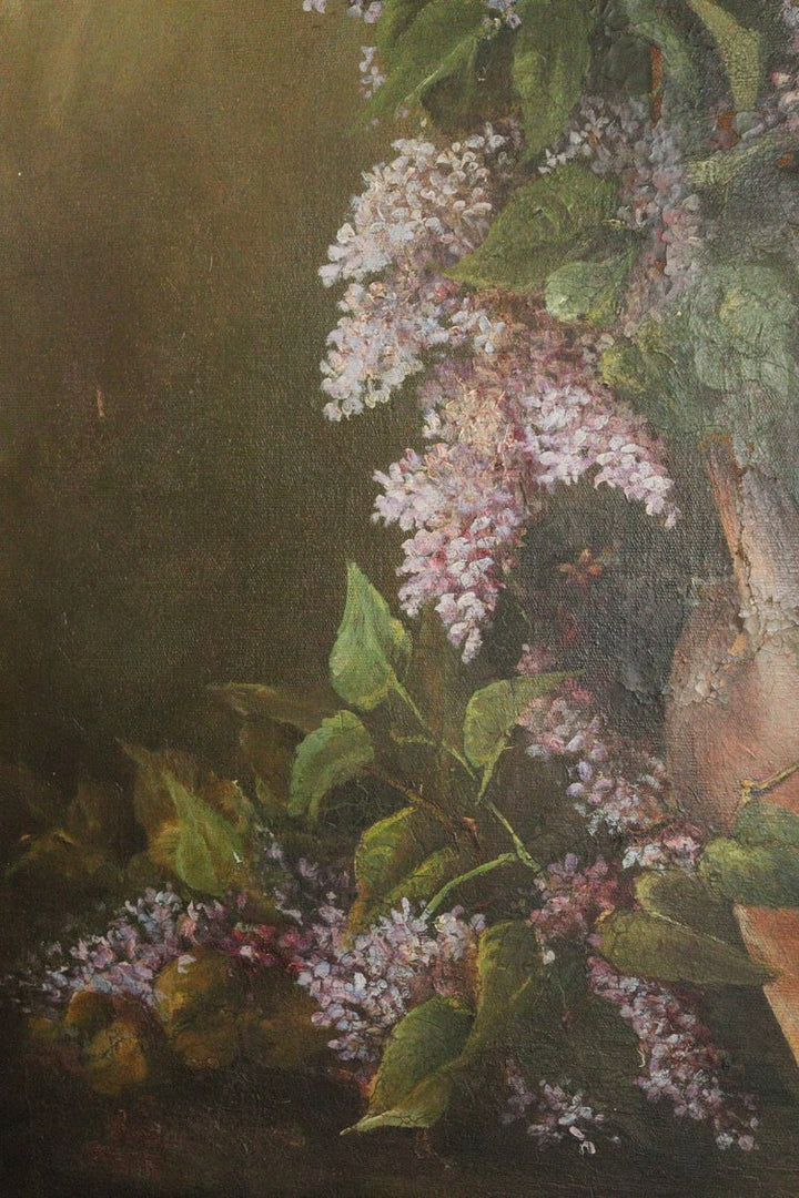 Close-up of lilac flowers with green leaves on a dark background