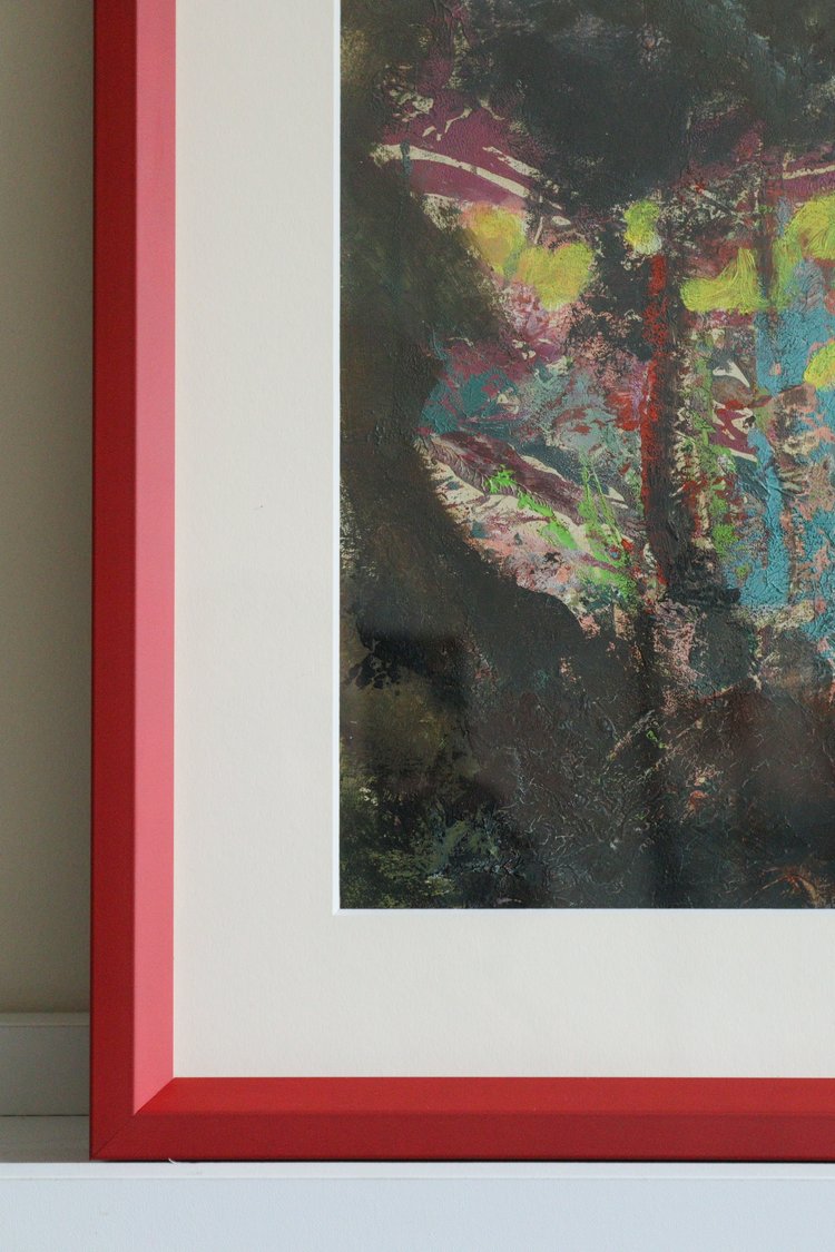 Abstract painting with a red frame on a light gray background