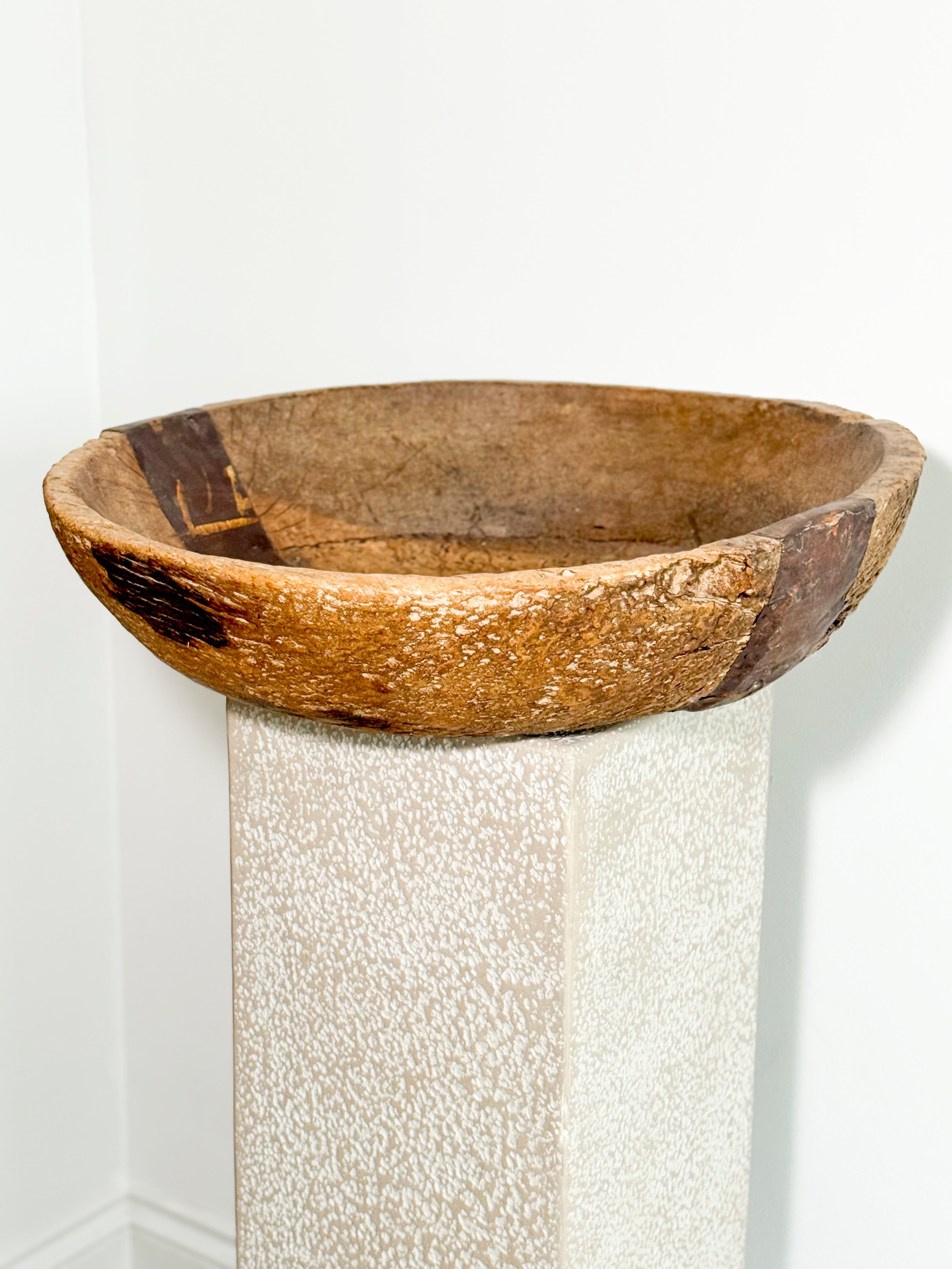 Antique hand-carved wooden bowl