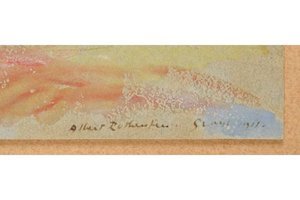 Close-up of a signature on a document with a decorative border